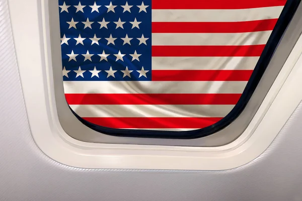 silk national flag of the modern state of usa with beautiful folds in the porthole of a plane, concept of tourism, economy, politics, emigration, globalization