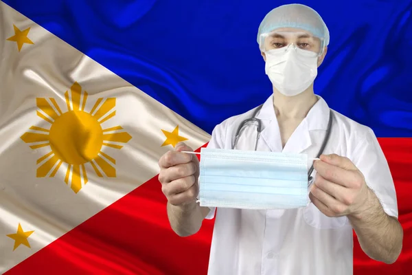 Máscara Médica Individual Manos Médico Contexto Bandera Nacional Las Filipinas —  Fotos de Stock