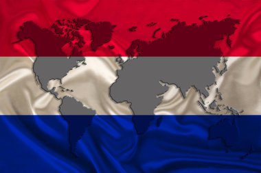 silhouette of a world map on the silk national flag of the modern state of Netherlands with beautiful folds, the concept of tourism, travel, emigration, global business clipart