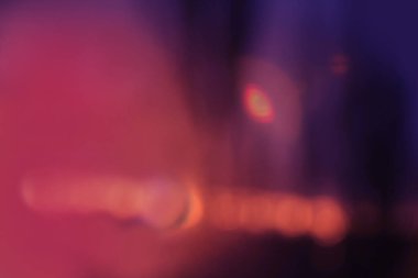 Bulanık leylak, turuncu mor arka plan, ışıklar ve röfleler, optik illüzyon konsepti, halo, UFO