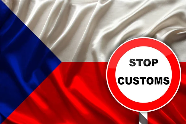 customs sign, stop, attention on the background of the silk national flag of the Czech Republic, the concept of border and customs control, violation of the state border, tourism restrictions