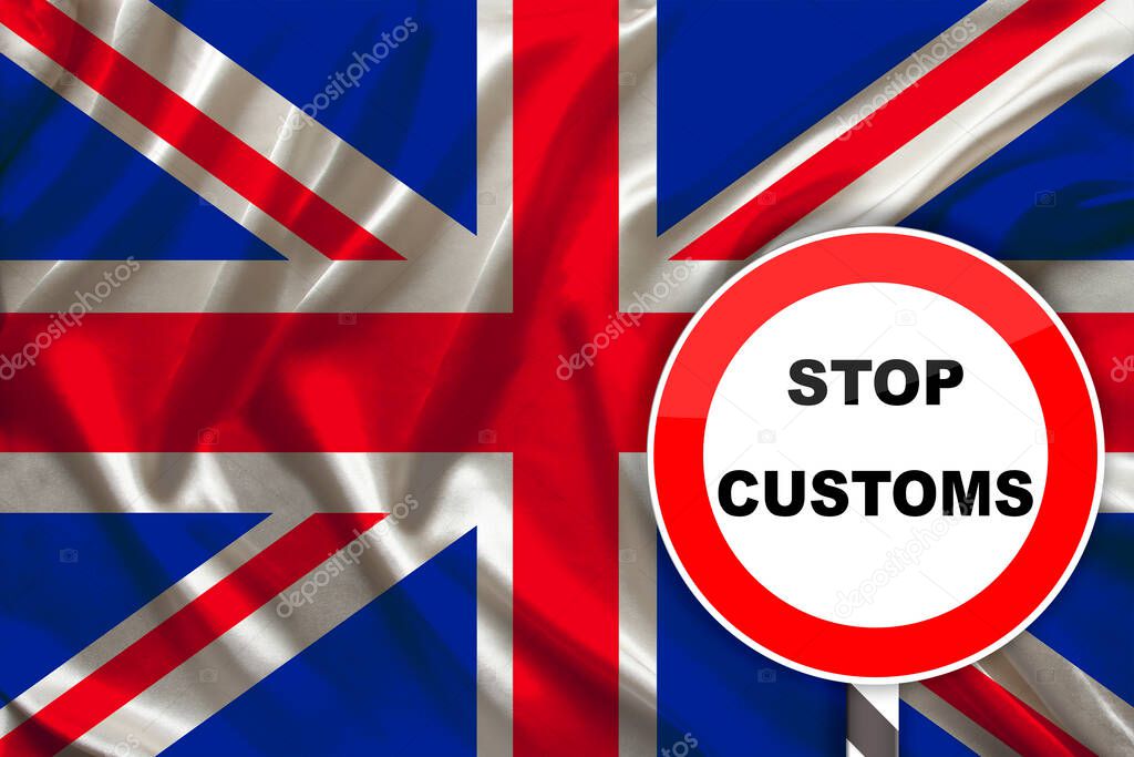 customs sign, stop, attention on the background of the silk national flag of Great Britain, the concept of border and customs control, violation of the state border, tourism restrictions