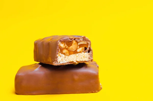 chocolate bars on a yellow background. sweets, candy