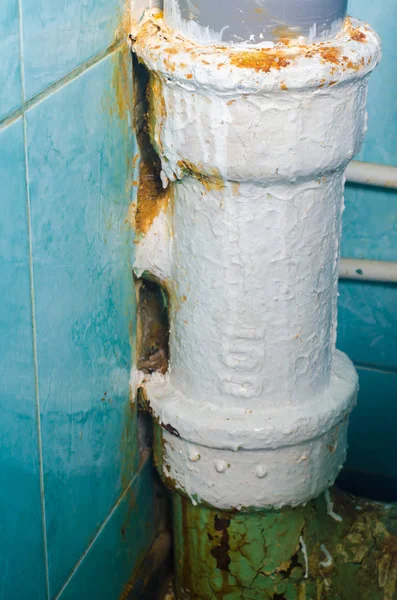 Rusty old toilet waste pipe in need of replacement