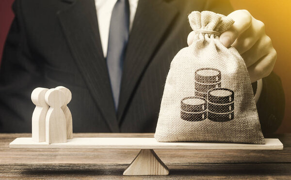 Man puts money bag and people on scales. Taxpayers concept. Decent salary pay for staff specialists. Business, crowdfunding startup. Investments in deposits. Social project financing. Labor migrants.