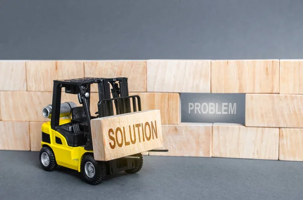 Forklift Intends to Insert block Solution into void Problem. Correction of errors and repair, search for the best resolution. Strengthening and improving a system or mechanism, Development.