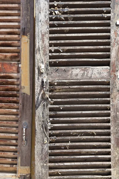 Weathered Wooden shutters for back ground use. A architectural abstract. — Stock Photo, Image