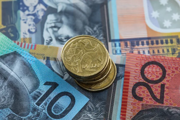 Australian Money - One dollar coin stack on Australian dollar no