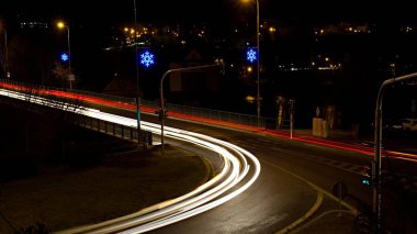 Christmas nonstop traffic, night road city light junction.