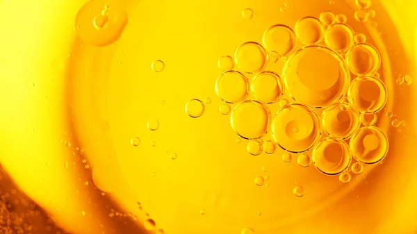 Oil Water Bubbles Yellow Background — Stockfoto