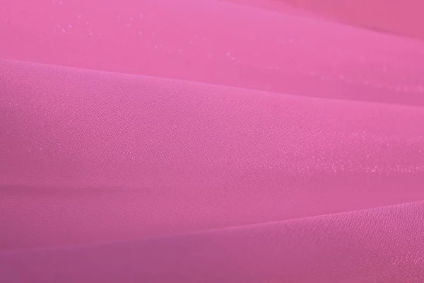 Closeup of pink cloth pattern, abstract background