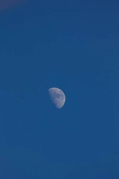 Moon on blue sky at daytime