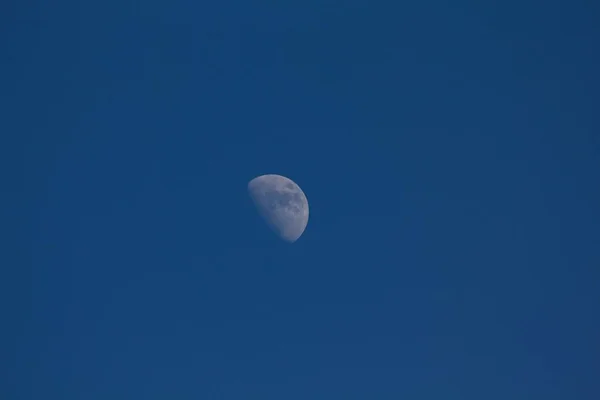 Moon on blue sky at daytime
