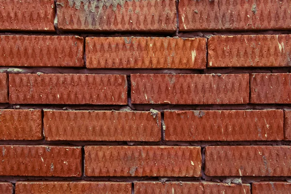Background of red corrugated textured brick — Stock Photo, Image