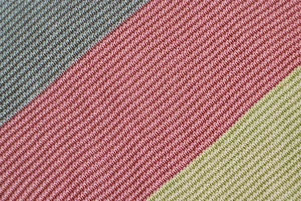 Knitted textured surface with colored stripes diagonally — Stock Photo, Image