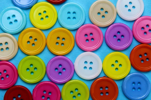 Textura Botones Multicolores Dispuestos Sobre Una Superficie Azul —  Fotos de Stock