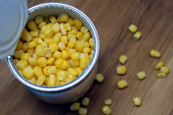 Jar of canned yellow corn on the table