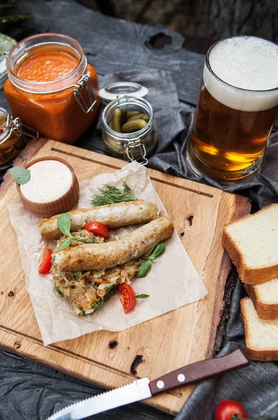 Rustic composition: chicken sausages on a grill with stewed cabb — Stock Image Rustic composition: chicken sausages on a grill with stewed cabb Royalty Free Stock Photos