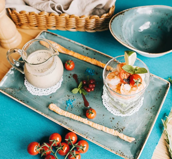 Summer soup okroshka with tiger shrimp and fresh cucumber in a blue plate — Stock Image Summer Soup Okroshka Tiger Shrimp Fresh Cucumber Blue Plate Stock Image