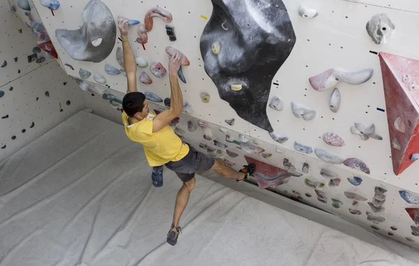 Indoor rock climbing man