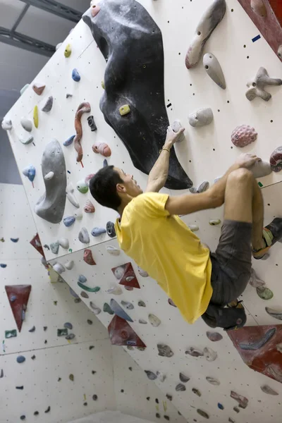 Indoor rock climbing man