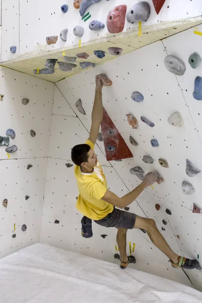 Indoor rock climbing man