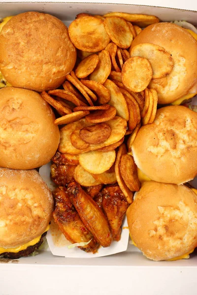 Large Box Burgers Fried Potato Slices Spicy Chicken Wings — Stock Photo, Image