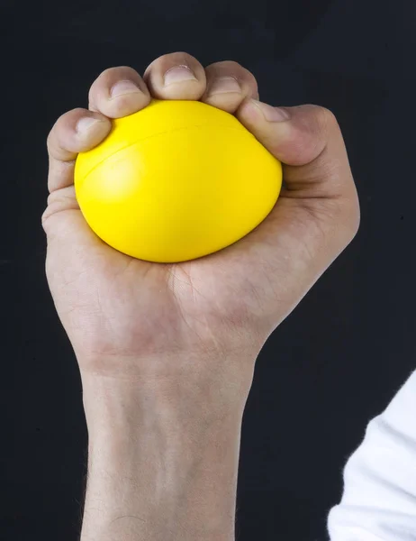 Сжатие мяча для стресса — стоковое фото