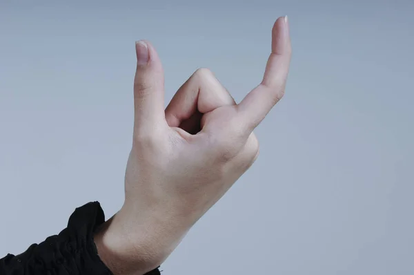 Female Hand Holding Isolated Card with Two Fingers — Stock Photo, Image