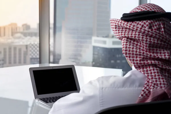 Saudi Arab Man Watching Laptop at Work Contemplating