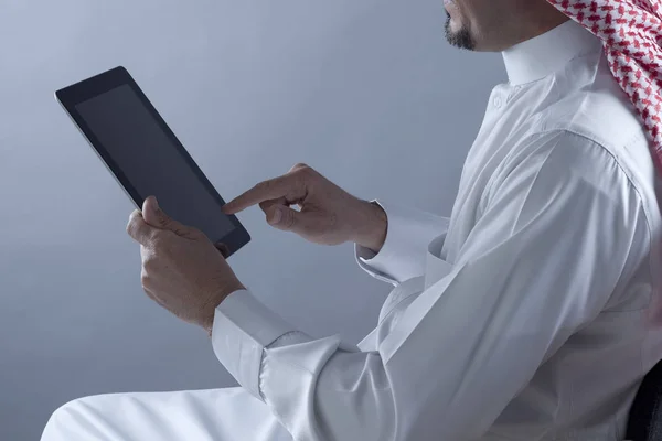 Saudi Arabian Man Hands Holding Tablet