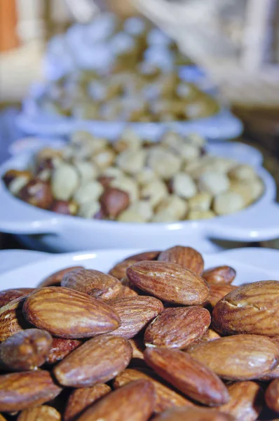 Almonds, Pistachios, Cashew Mix of Nuts in Plates — Stock Photo, Image