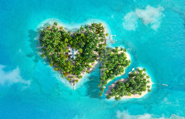 Tropical islands in the shape of two hearts, one is broken — Stock Photo, Image