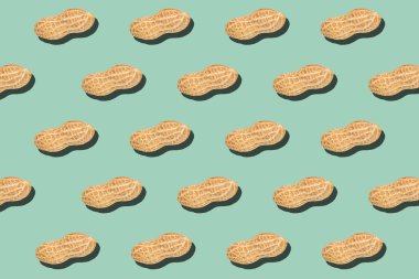 Açık yeşil arka plan fındık besin dokusunda çatlak yer fıstığı minimumu desen