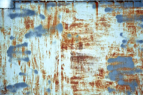 Rozsdamentes fém textúra hámló festékkel, kék színnel. Textúrális háttér, másoló tér, felülről fotózva. szöveges alátét. — Stock Fotó