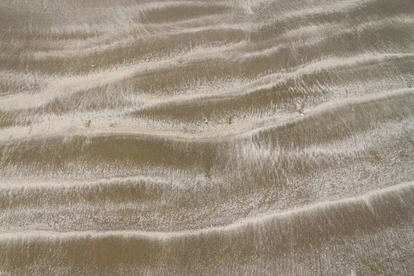 Száraz felett nedves homok és a hullámok Cassino Beach — Stock Fotó