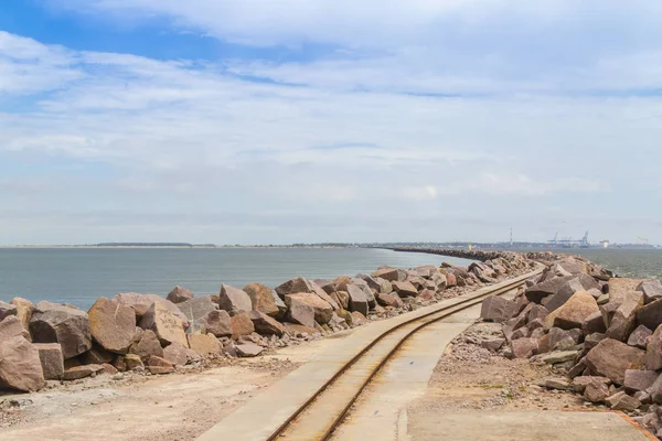 Rail over breakwater at Cassino beach — Stock Photo, Image