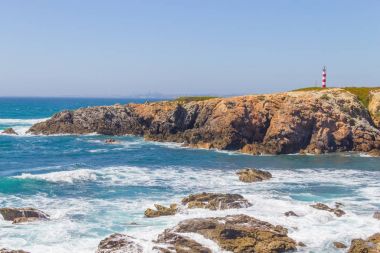 Lighthouse in Porto Covo beach