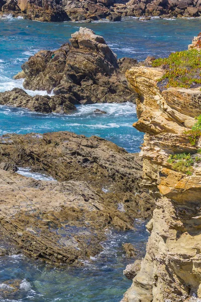 Rocce nella spiaggia di Porto Covo — Foto Stock