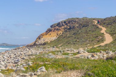 Hiking in trail in Queimado beach,  Vila Nova de Milfontes