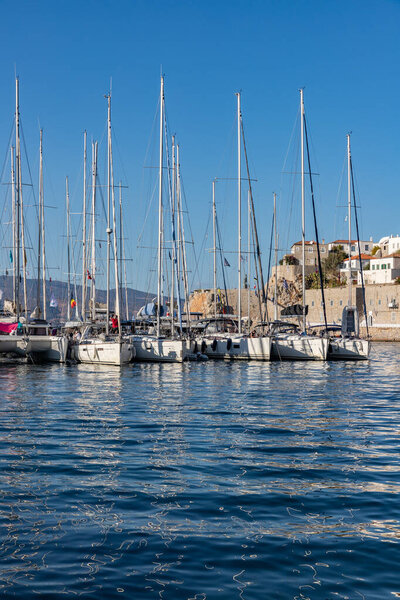 Boats and buildings around pier in Hydra Island