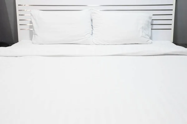 White bed sheets and pillows