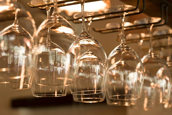 Empty glasses for wine above a bar