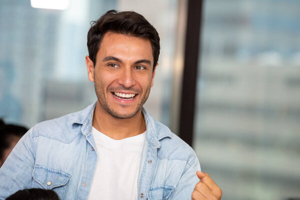 Handsome man smiling in the office, Feeling positive concept