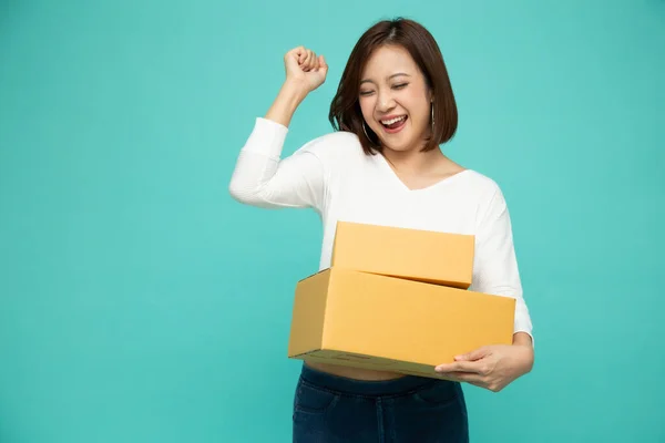 stock image Happy Asian woman holding package parcel box, Delivery courier and shipment service concept