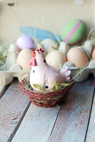 Easter toy chicken, eggs on a wooden windowsill, spring, festive home decor