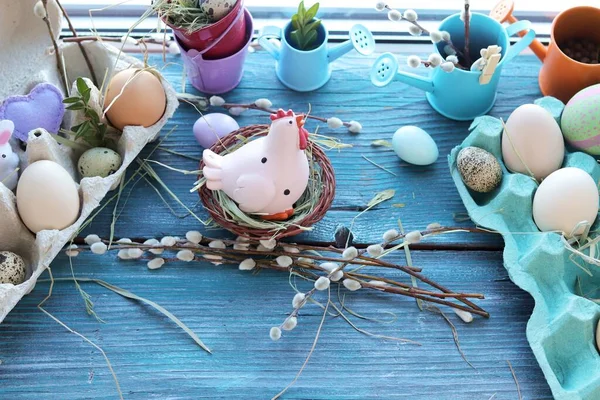 Easter toy chicken, eggs on a wooden windowsill, spring, festive home decor
