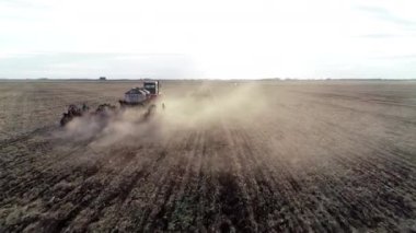 Industry farming work by tractor, rural machine on agriculture field, farm land