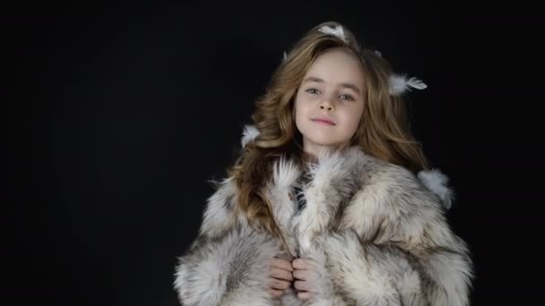 Smiling little face girl looks camera, beautiful fashion kid, child model posing — Stock video