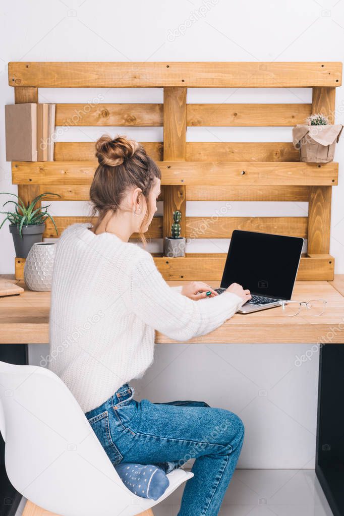 girl working with laptop in modern office